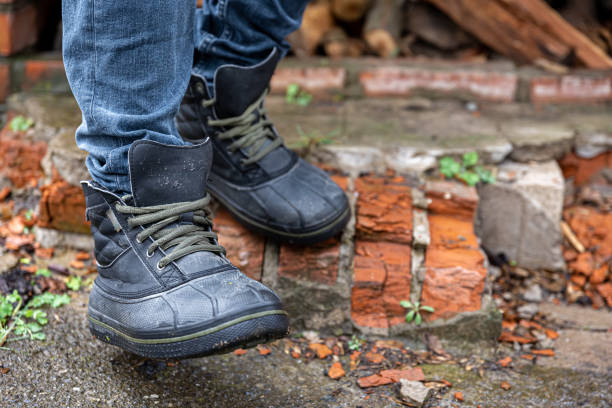 istock A pair of durable men's boots, legs close-up. 1482890617