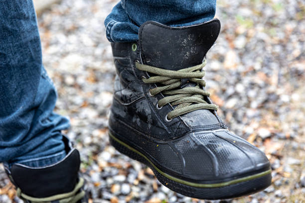 istock A man in boots stands on gravel, close up. 1482890626