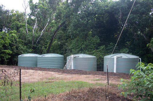 Four assembled Rainwater Storage Tanks on acreage Surrounded by Rainforest, Far North Queensland, Australia