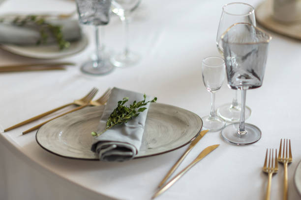 istock table setting. Interior of space is loft-style with tables 1482891475