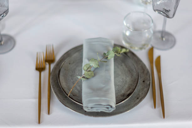 istock table setting. Interior of space is loft-style with tables 1482891693