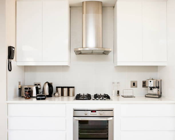 Modern kitchen Stylish white-and-chrome domestic kitchen. coffee maker in kitchen stock pictures, royalty-free photos & images