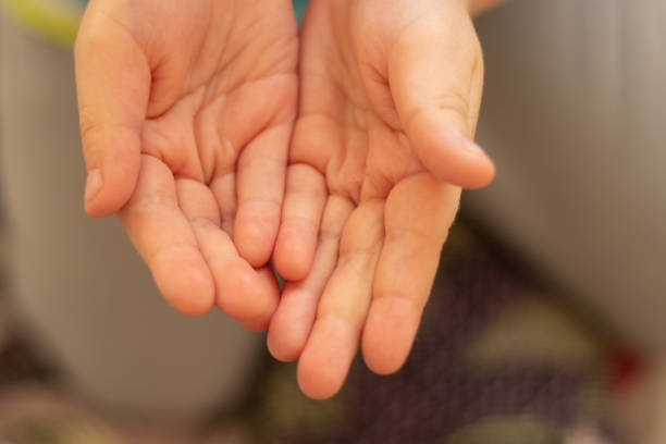 istock children's outstretched hands on a blurred background 1482894425