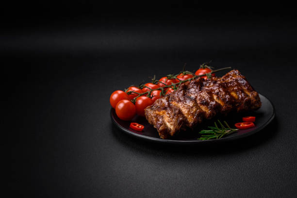 istock Delicious grilled pork ribs with sauce, spices and herbs 1482896502