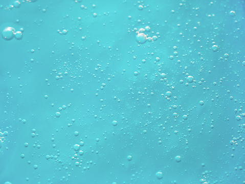 Air bubbles in clear blue water in pool (underwater shot), good for backgrounds