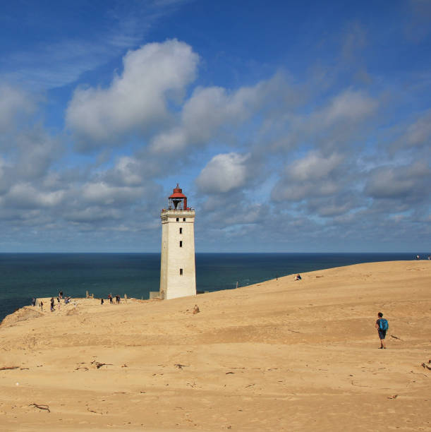istock Old lighthouse partly covered by a high sand dune. Rubjerg Knude, 1482896959
