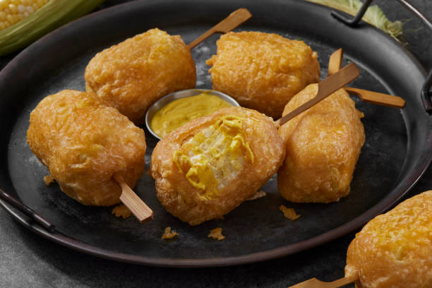 Beer Battered Corn on the Corn Beer Battered Corn on the Corn with Spicy Mustard Dip corn cob eaten stock pictures, royalty-free photos & images