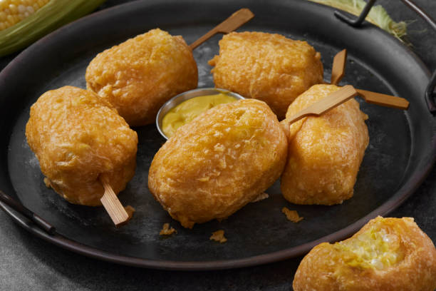 Beer Battered Corn on the Corn Beer Battered Corn on the Corn with Spicy Mustard Dip corn cob eaten stock pictures, royalty-free photos & images