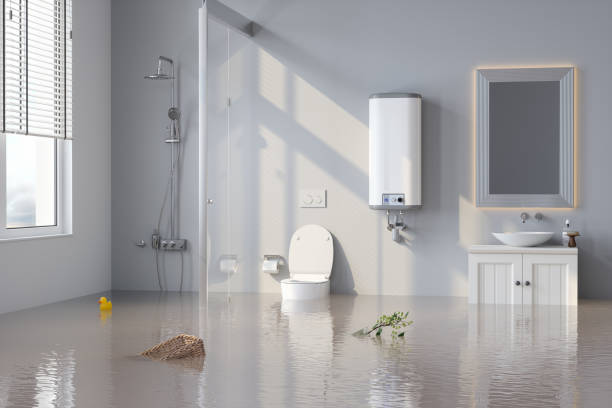 Flooded Bathroom With Plant And Basket Floating On Water.