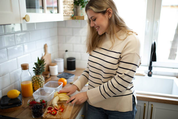 istock Woman preparing a healthy and fresh fruit salad 1482900650