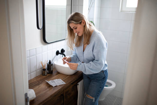 istock Woman doing a pregnancy test in the bathroom 1482900655