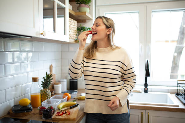 istock Woman preparing a healthy and fresh fruit salad 1482900675