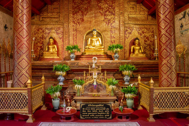 the phra buddha sihing statue in the viharn lai kham at wat phra singh , chiang mai , thailand - religion buddha buddhism temple imagens e fotografias de stock