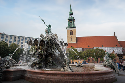 Neptune Fountain and St. Mary Church (fountain designed by Reinhold Begas in 1891) - Berlin, Germany