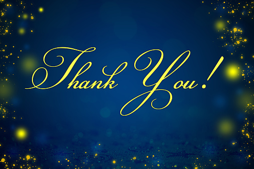 'Thank you!' written on a festive sparkling background with beautiful bokeh lights. Space for copy.