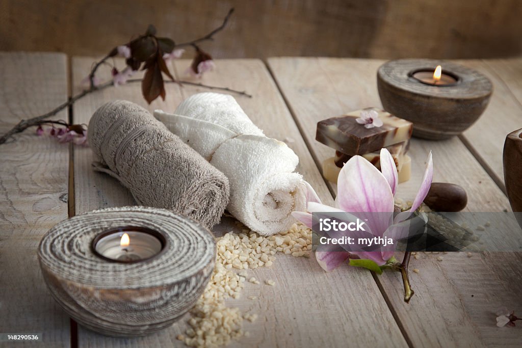 Natural spa setting Spa and wellness setting with natural soap, candles and towel. Beige dayspa nature set Bar Of Soap Stock Photo