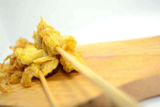 istock The egg rolls stand upright on a wooden plank 1482908594