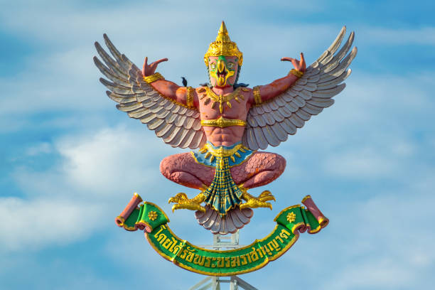 The National Emblem of Thailand, a mythical figure called garuda, on a building in Bangkok.