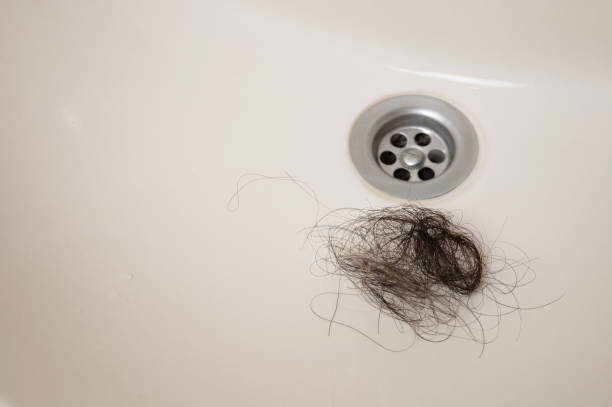 istock Human hair clogged in sink 1482909904