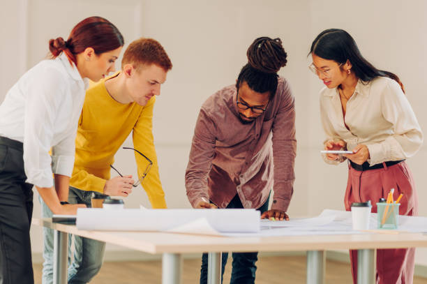 istock Multiracial team of engineers or architects having a meeting in an office 1482915034