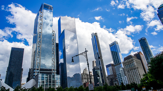 New York, NY, USA  - June 9, 2022: Reflection in modern architecture on Mahattan near West Side Street highway.