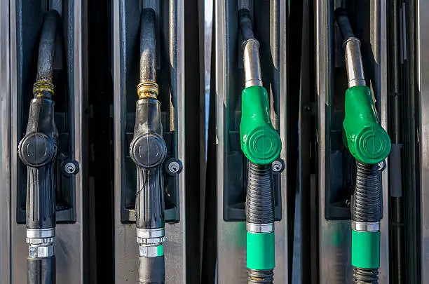 Two pairs of gasoline pumps at petrol station