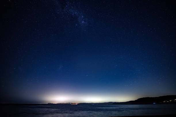 istock Stargazing at the night sky with a clear sky and milky way 1482934728