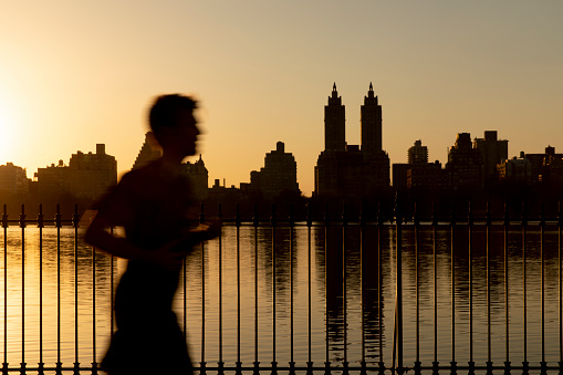 Jogger during sunset in Central Park NYC