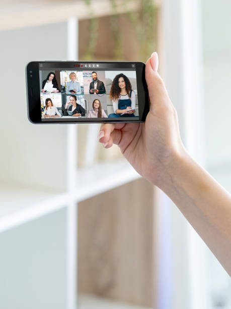 istock mobile conference business meeting team on screen 1482944994
