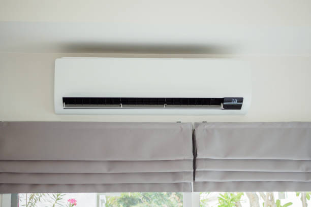 istock Air conditioner on white wall room interior background 1482946088