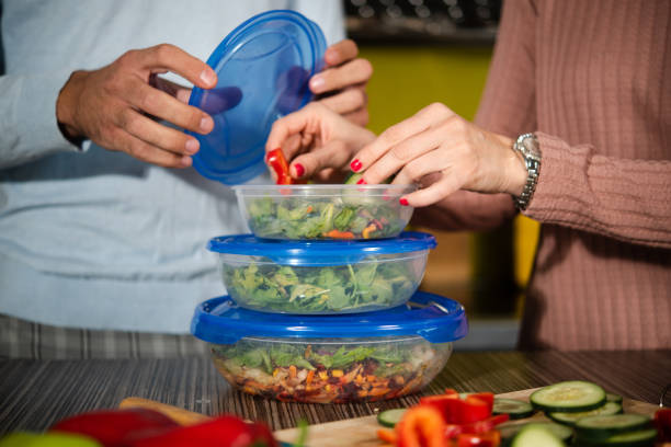 istock Unrecognizable couple preparing their vegan meal to go 1482947346