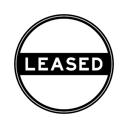 Black color round seal sticker in word leased on white background