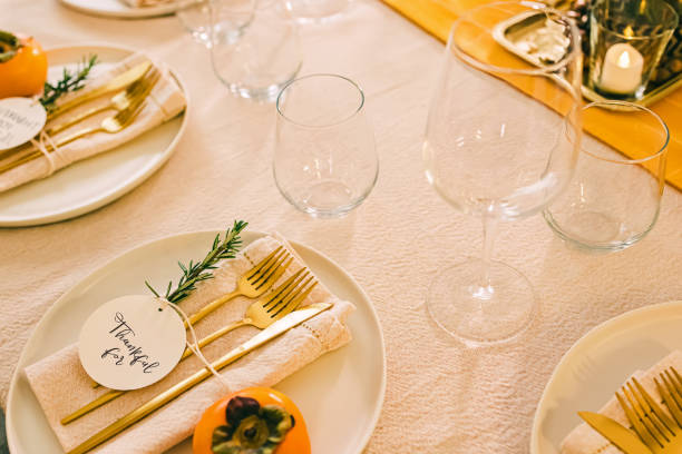 istock Thanksgiving dinner table setting in golden colors. 1482952808