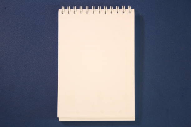 a Blank Paper on top of Blue Table