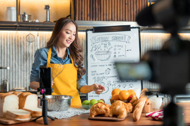 istock Asian Female Chef Talks about Ingredients, Teaches to bake bread. Online Video Class, Streaming Service of e-Learning Video Course.  bread Recipe Preparation record live online social media in studio 1482966189