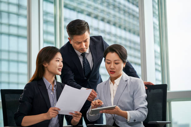 istock asian corporate executives discussing business in office 1482966271