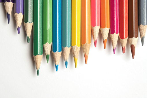istock Colored pencils lie in a row. A line drawn with pencil tips. Set of crayons for illustrations, art, study. Ready for school. 1482969823