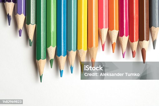 istock Colored pencils lie in a row. A line drawn with pencil tips. Set of crayons for illustrations, art, study. Ready for school. 1482969823