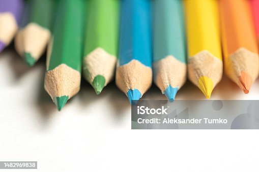 istock Colored pencils lie in a row. A line drawn with pencil tips. Set of crayons for illustrations, art, study. Ready for school. 1482969838