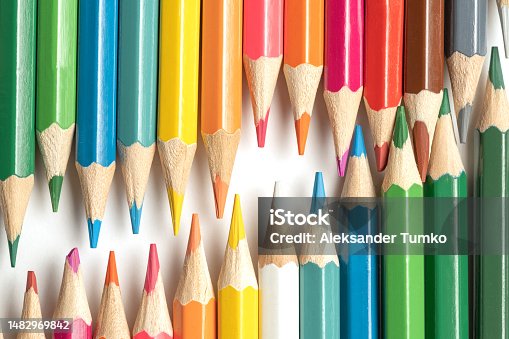 istock Colored pencils lie in a row. A line drawn with pencil tips. Set of crayons for illustrations, art, study. Ready for school. 1482969842