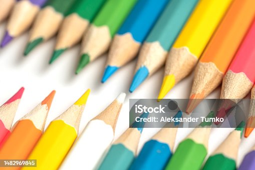 istock Colored pencils lie in a row. A line drawn with pencil tips. Set of crayons for illustrations, art, study. Ready for school. 1482969845