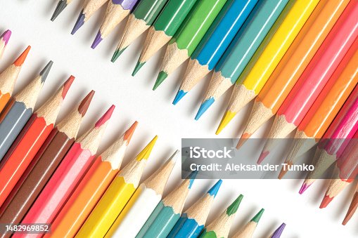 istock Colored pencils lie in a row. A line drawn with pencil tips. Set of crayons for illustrations, art, study. Ready for school. 1482969852