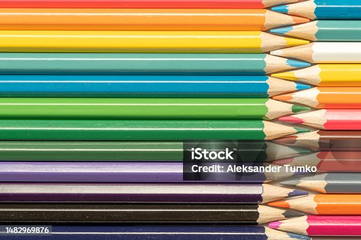 istock Colored pencils lie in a row. A line drawn with pencil tips. Set of crayons for illustrations, art, study. Ready for school. 1482969876