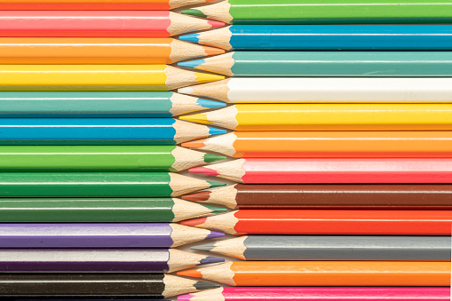 istock Colored pencils lie in a row. A line drawn with pencil tips. Set of crayons for illustrations, art, study. Ready for school. 1482969878