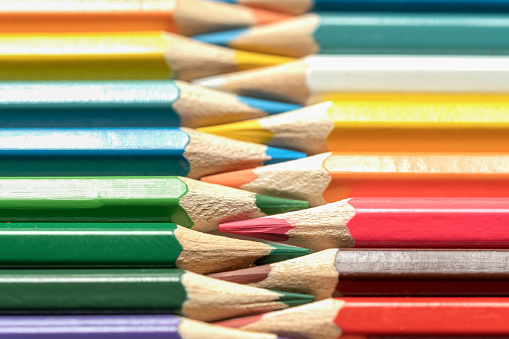istock Colored pencils lie in a row. A line drawn with pencil tips. Set of crayons for illustrations, art, study. Ready for school. 1482969879