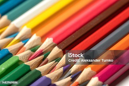 istock Colored pencils lie in a row. A line drawn with pencil tips. Set of crayons for illustrations, art, study. Ready for school. 1482969886