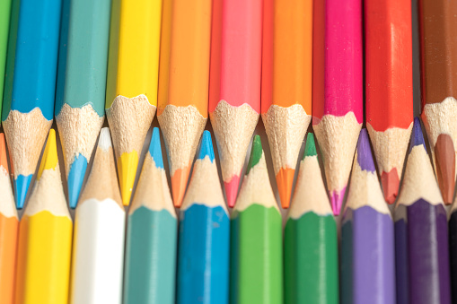 istock Colored pencils lie in a row. A line drawn with pencil tips. Set of crayons for illustrations, art, study. Ready for school. 1482969902