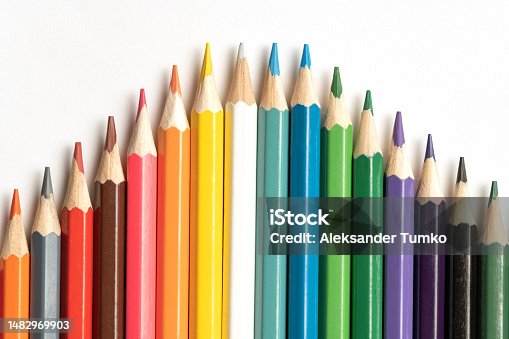istock Colored pencils lie in a row. A line drawn with pencil tips. Set of crayons for illustrations, art, study. Ready for school. 1482969903