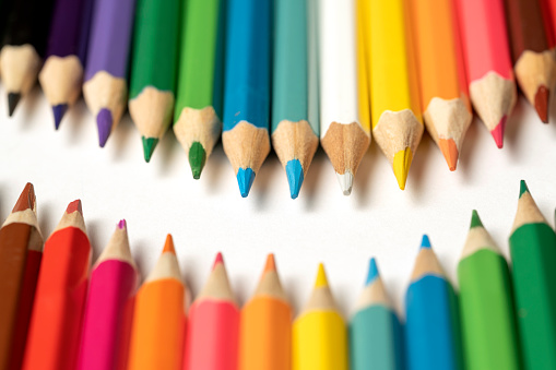 istock Colored pencils lie in a row. A line drawn with pencil tips. Set of crayons for illustrations, art, study. Ready for school. 1482969923