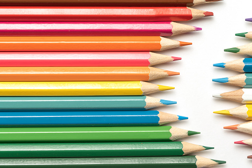 istock Colored pencils lie in a row. A line drawn with pencil tips. Set of crayons for illustrations, art, study. Ready for school. 1482969939